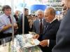 Путин на книжной ярмарке пошутил с обанкротившейся &quot;Детской литературой&quot;: &quot;У вас нет крыши&quot;