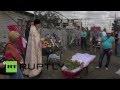Ukraine: Mother buries five year old child and husband in E. Ukraine *GRAPHIC*