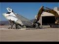 Крушитель: самолет ломают спецтехникой