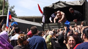 Российские военнослужащие доставили в Алеппо гуманитарную помощь для 65 семей российского происхождения