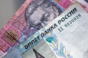 Президент РФ подписал закон о погашении долгов крымчан перед банками Украины